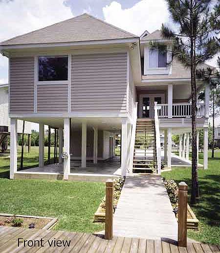 House plan exterior: Coastal style, elevated two-story home with a large deck, exterior stairs, and open ground level for parking.