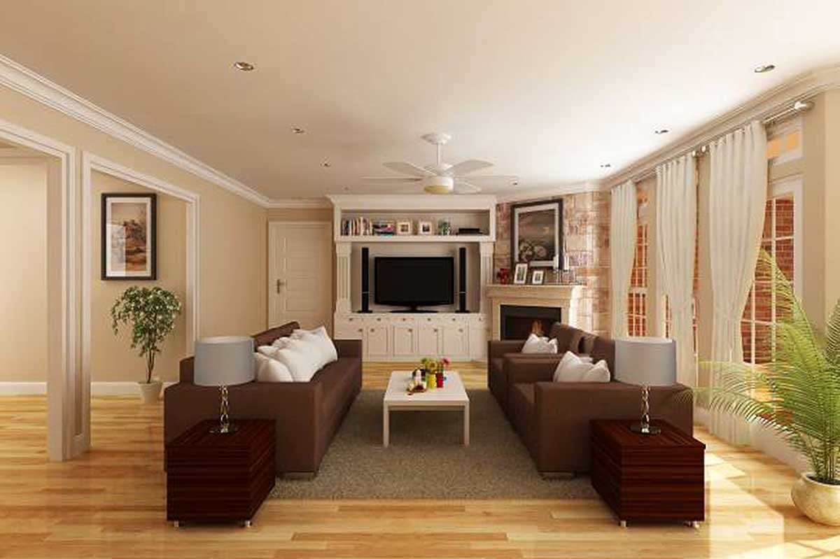Living room with two brown sofas, a central fireplace, and a built-in entertainment center with a television.