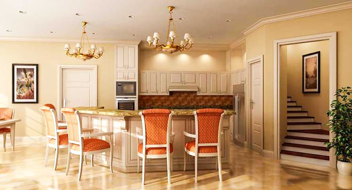 Kitchen with island, bar seating, cream cabinetry, backsplash, and staircase in background.