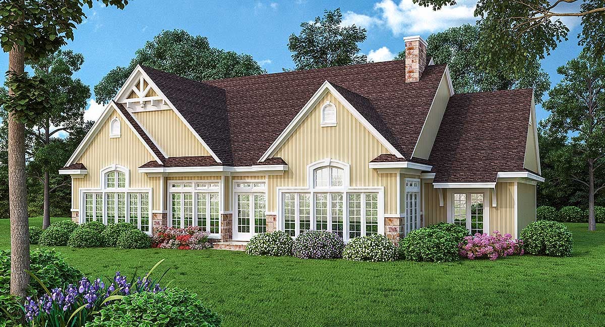 House plan exterior features gable dormers, multiple window styles including arched, and a brick chimney.