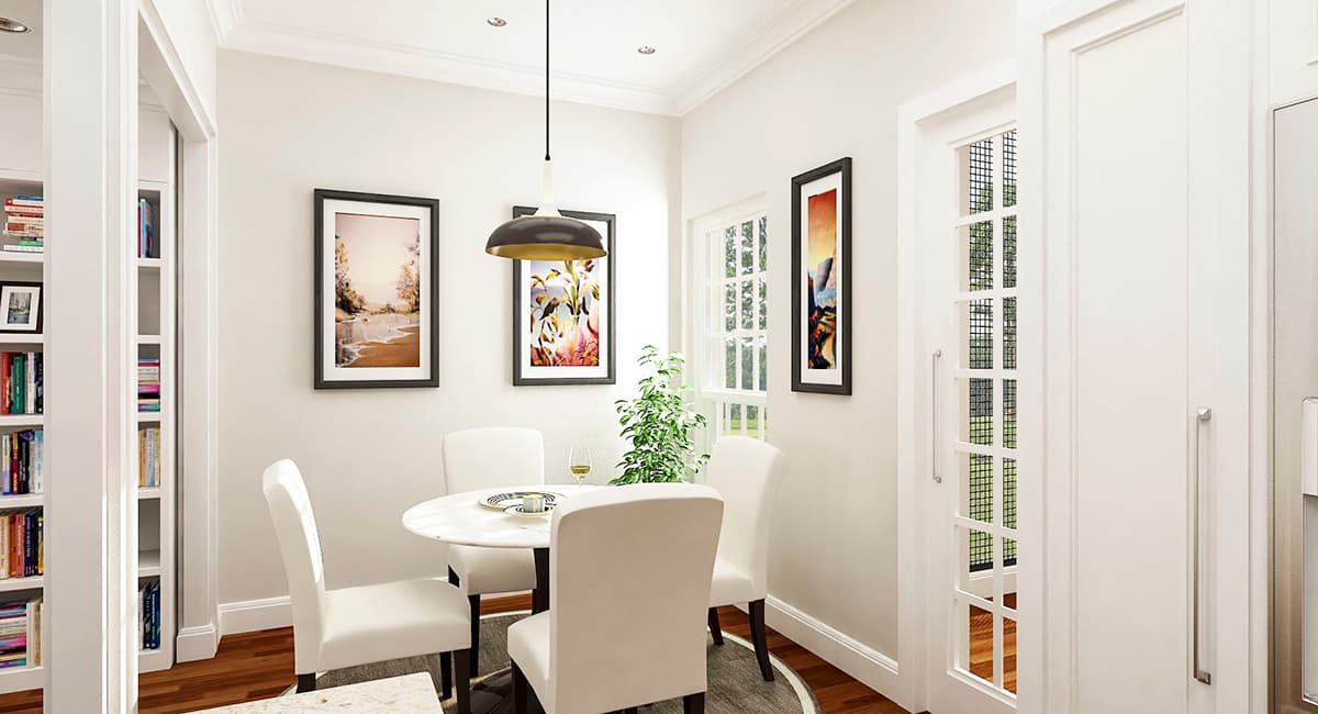 Dining area with round table, four chairs, built-in bookshelves, and a glass-paneled door.