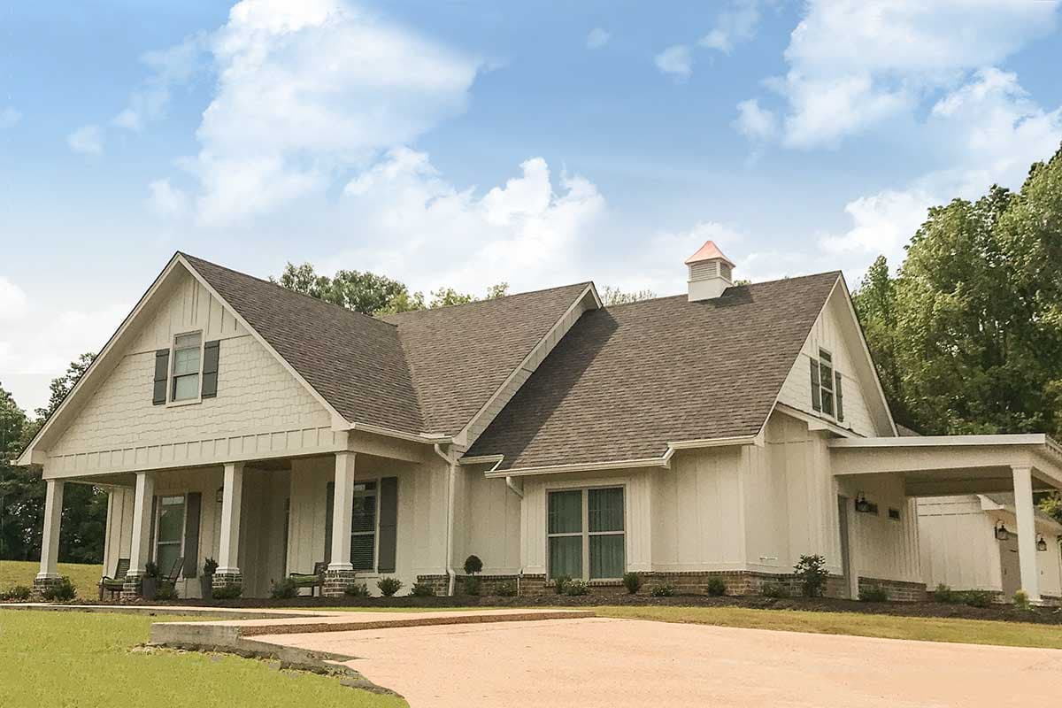 Modern Farmhouse house plan exterior with a gabled roof, covered porch with columns, and a cupola.