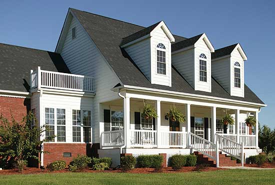House plan exterior: Two-story Modern Farmhouse with wrap-around porch, dormers, and upper-level balcony.