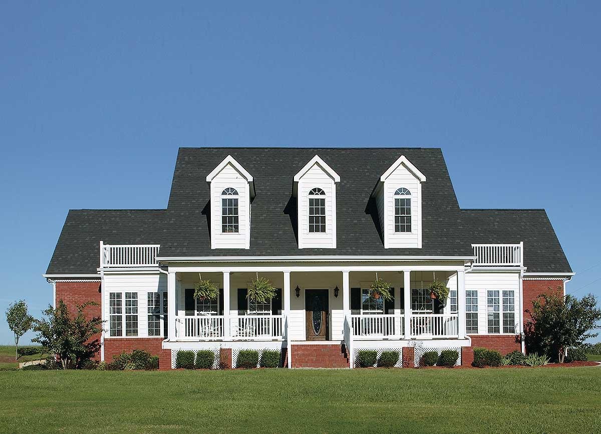 House plan exterior: Two-story Southern Colonial with full-width porch, three prominent dormers, and red brick accents.