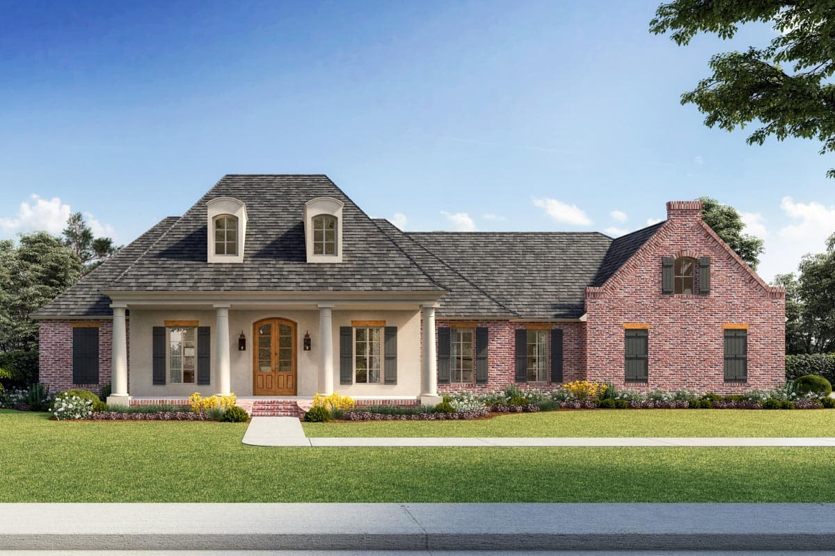 House plan exterior featuring a one-story, brick and stucco facade. Includes a covered porch, dormers, and gabled rooflines.