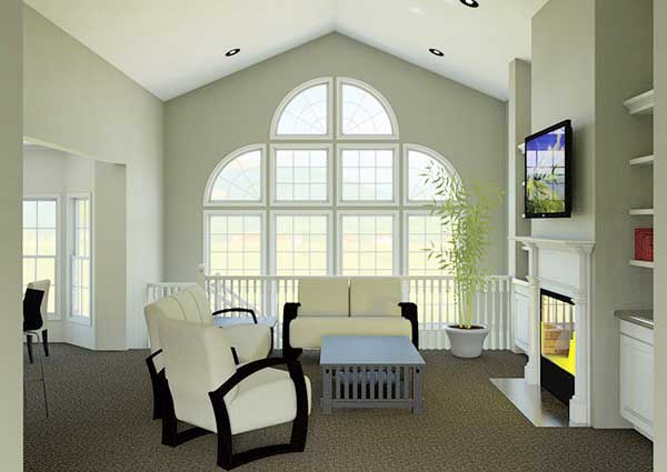 Great room with vaulted ceiling, fireplace, and large arched window wall with multiple panes.