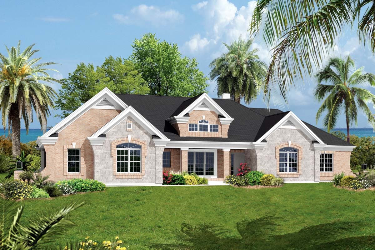 House plan exterior: One-story home with brick and stone facade, gabled rooflines, arched windows, and covered entryway.
