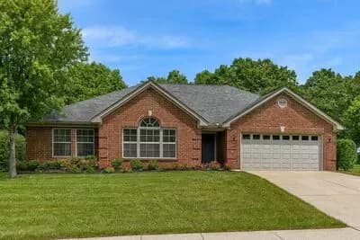 Elegant Traditional Brick House Plan with Split Bedrooms and 2-Car Garage