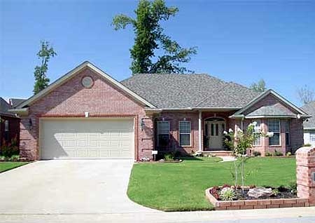 House plan exterior: One-story brick home with attached two-car garage, gable roof, and covered front entry.