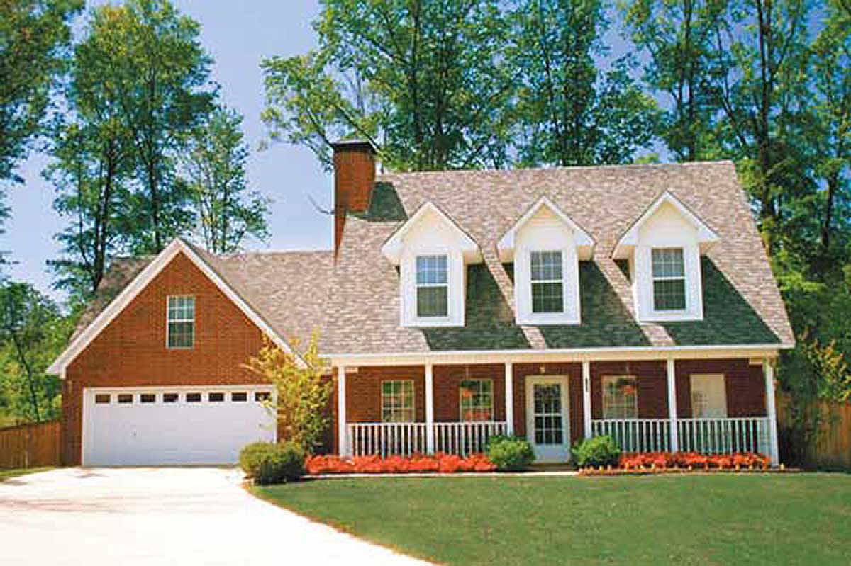 House plan exterior: brick, two-story, side-entry garage, gabled dormers, full-width porch with white railings.