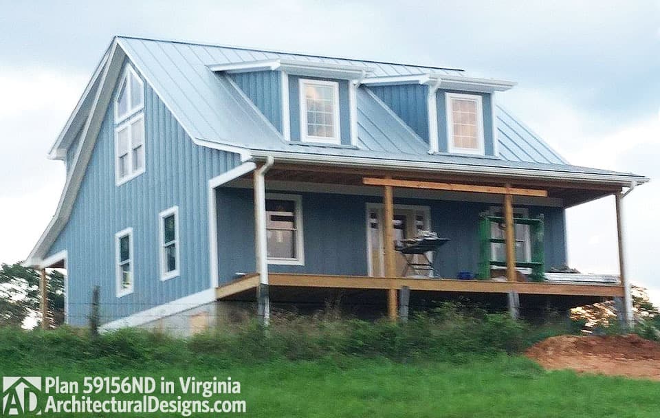 House plan exterior: Two-story Modern Farmhouse with metal roof, gabled dormers, and wraparound porch.