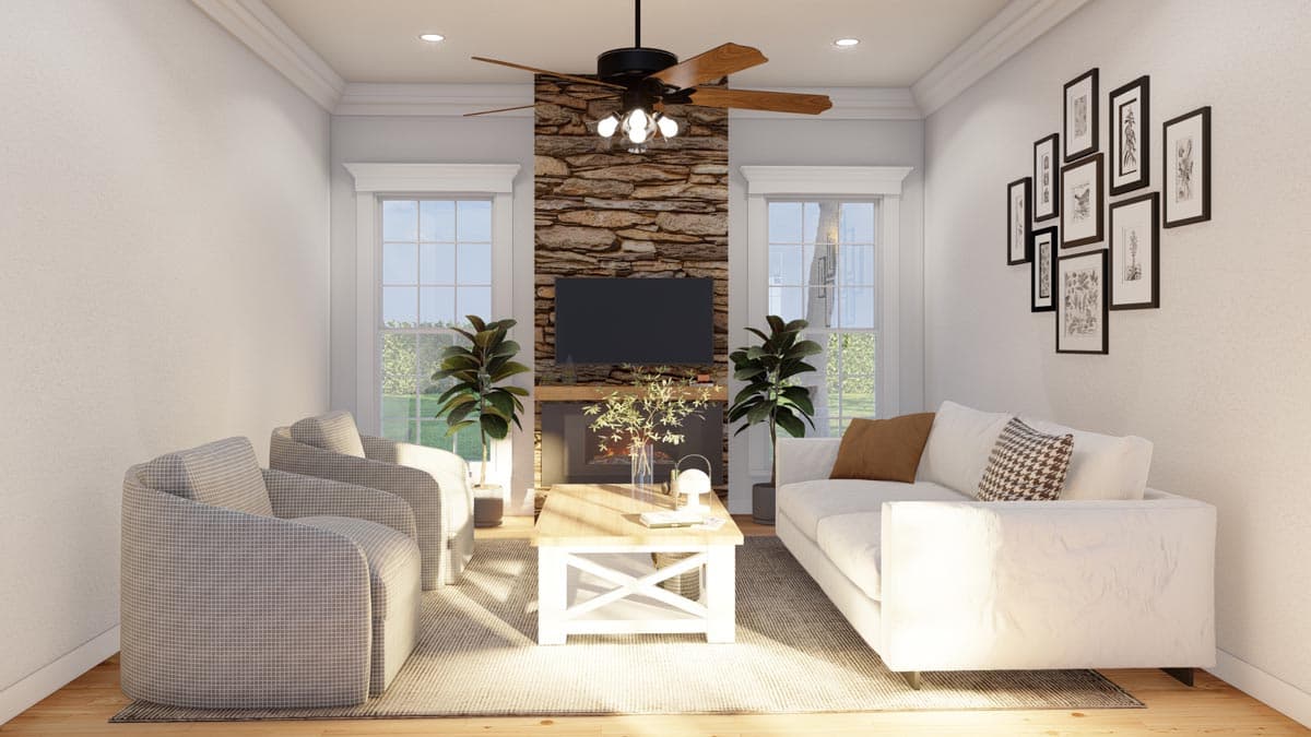 Living room with stone fireplace, TV, two windows, and seating area with sofa and chairs.