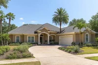 Spacious Florida-Style Ranch House Plan with Versatile Living and Courtyard Garage