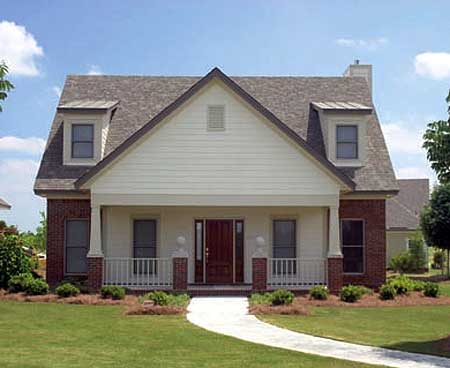 House plan exterior: two-story dwelling with brick facade, covered front porch, gable dormers, and steep roof.