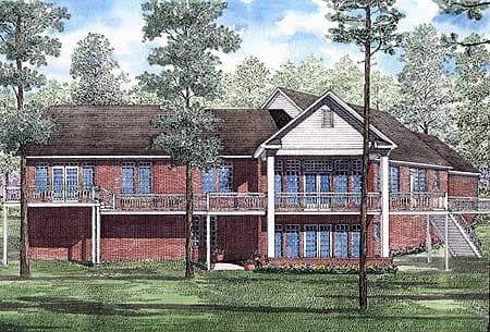 House plan exterior: Two-story brick home with wraparound balconies, multiple gables, and a prominent central dormer.