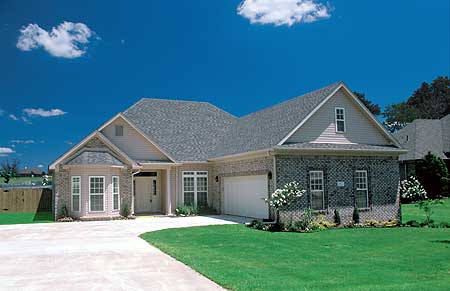 House plan exterior: One-story home with brick and siding, prominent gables, dormer window, and attached garage.