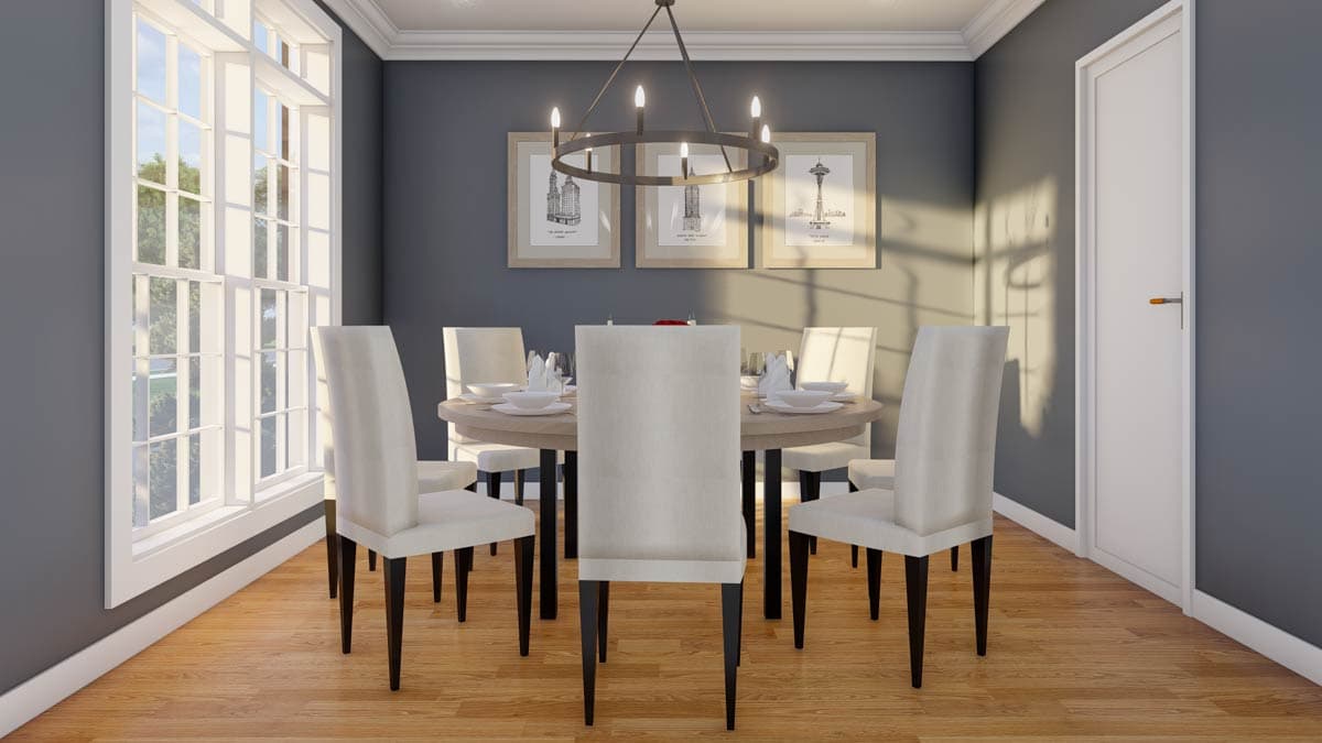 Dining room with round table, six chairs, large windows, circular chandelier, and three framed art prints.