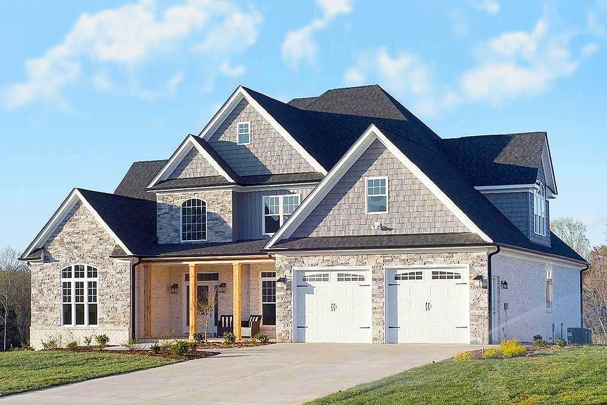 House plan exterior with two stories. Features include gabled rooflines, stone facade, front porch, and a two-car garage.