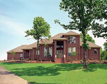 House plan exterior of a two-story brick home with a prominent covered entrance, arched windows, and varied rooflines.