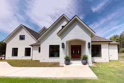 European Traditional House Plan with First-Floor Master Suite and 3-Car Garage