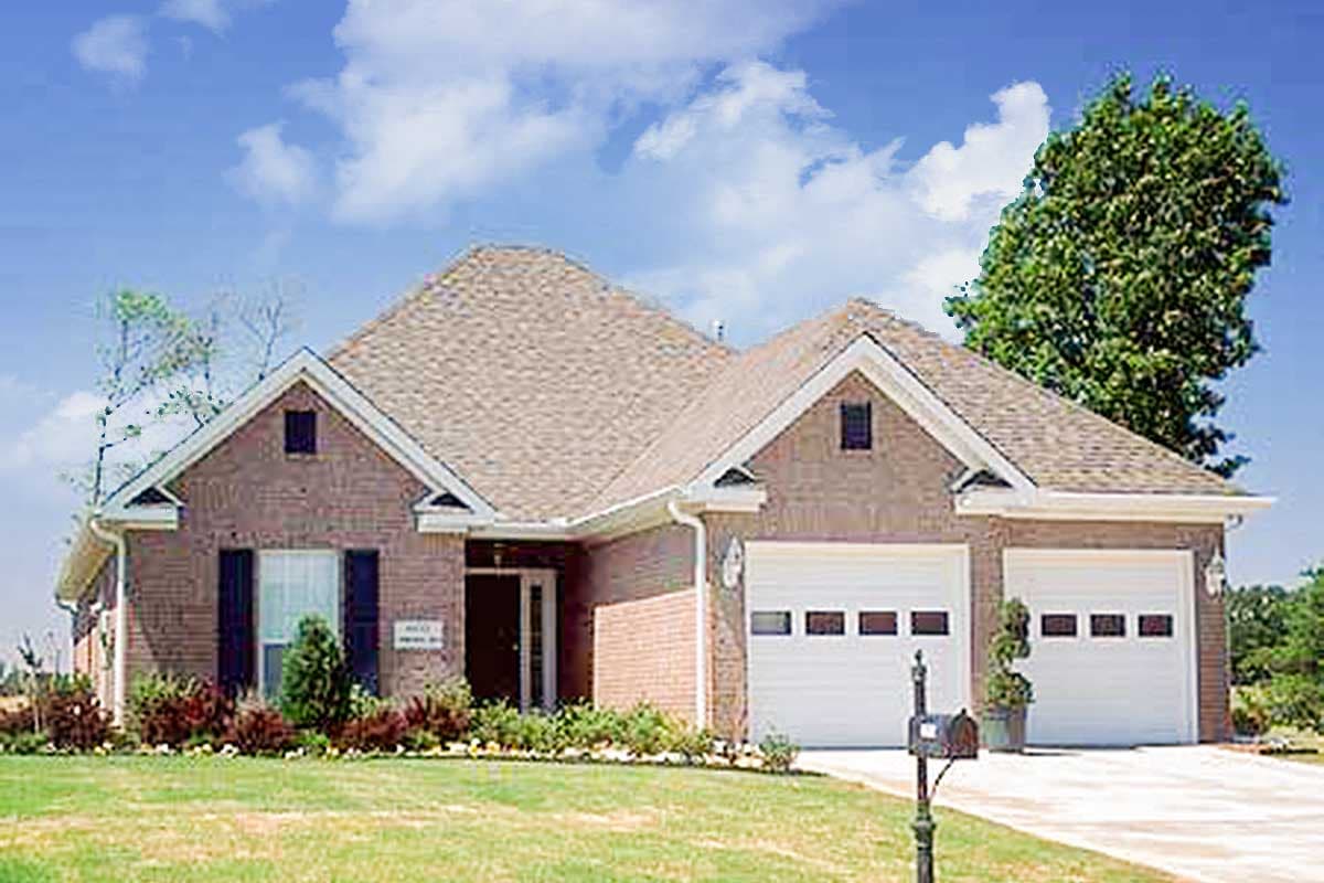 House plan exterior: Brick ranch with gable dormers, covered entry, and a side-entry two-car garage.