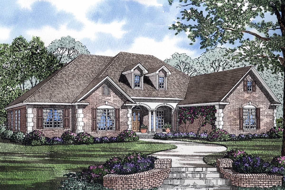House plan exterior: Brick home with arched windows, dormers, and a covered arched entry porch.