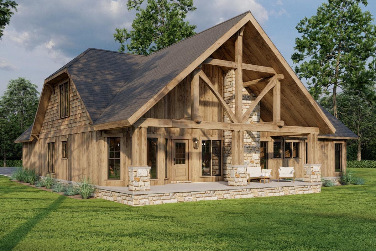 House plan exterior: Modern A-frame style with wood siding, stone accents, exposed beams, and a covered porch.