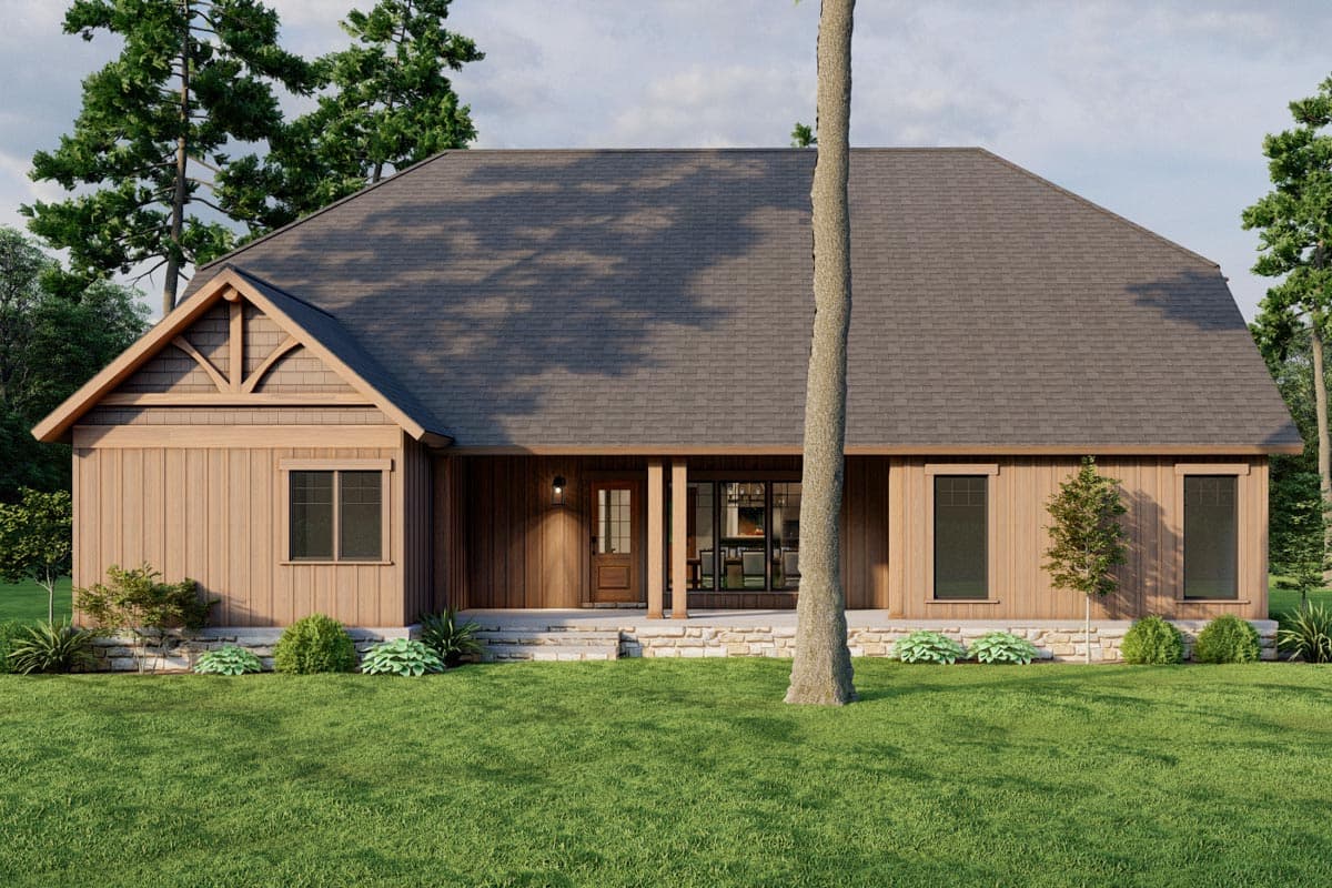 House plan exterior, one story, vertical wood siding, gable with decorative rafter tails, covered porch with stone foundation.