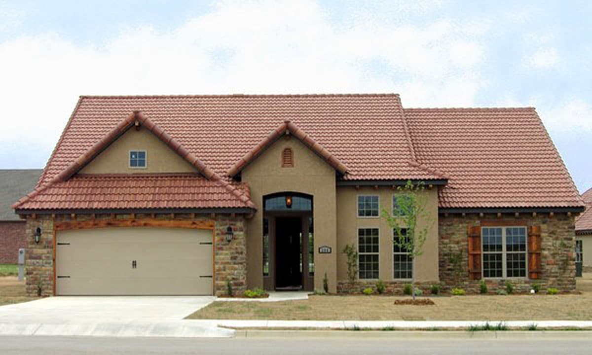 House plan exterior featuring a tile roof, stone accents, a side-entry garage, and a covered entryway.