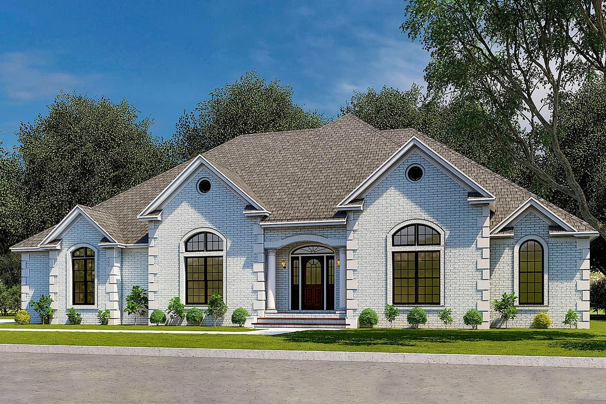 House plan exterior. One-story house with arched windows, gables, and a columned entry porch. Light-colored brick facade and a grey shingled roof.
