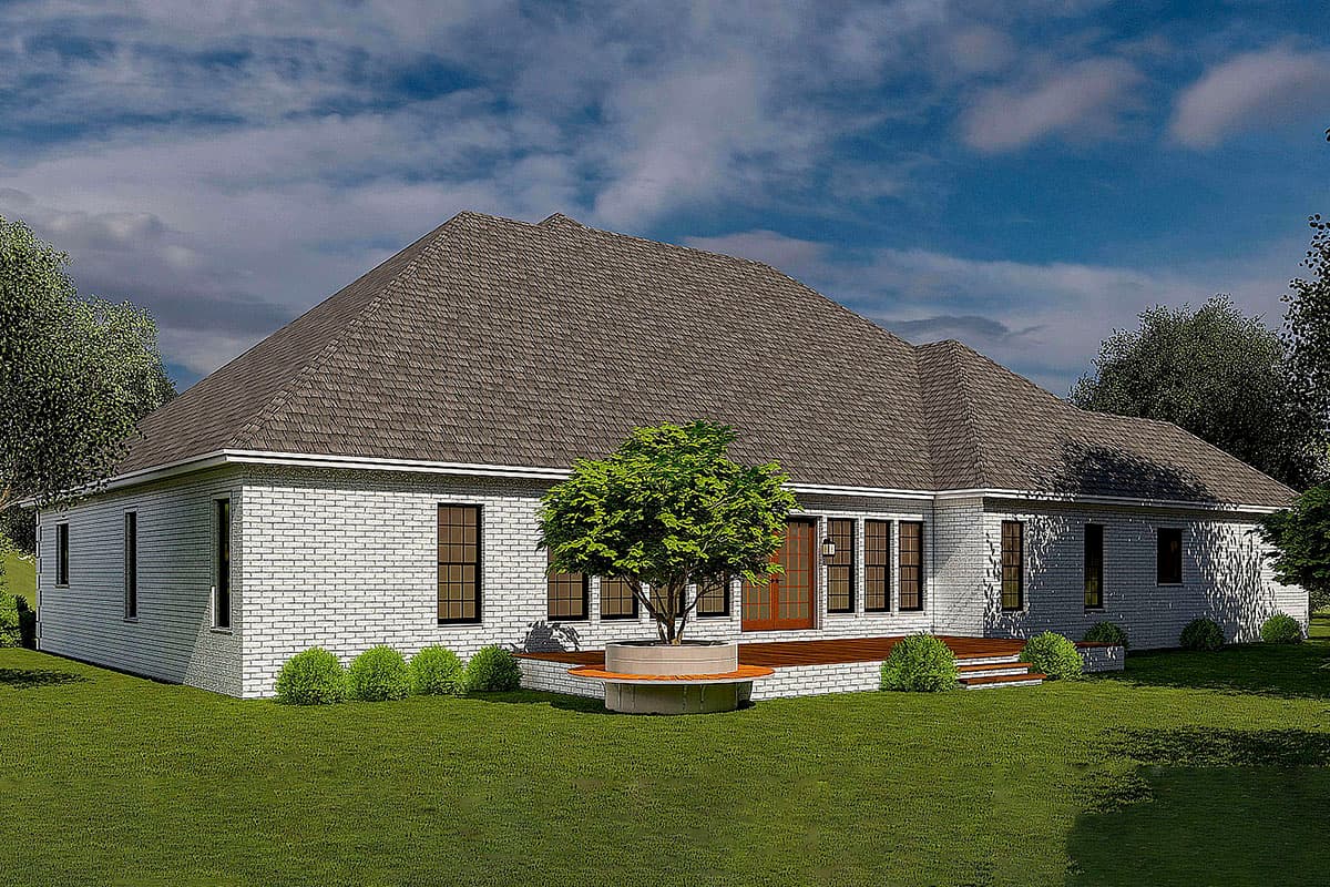 House plan exterior, one story, white brick, large roof, deck with tree planter and bench, multiple windows.