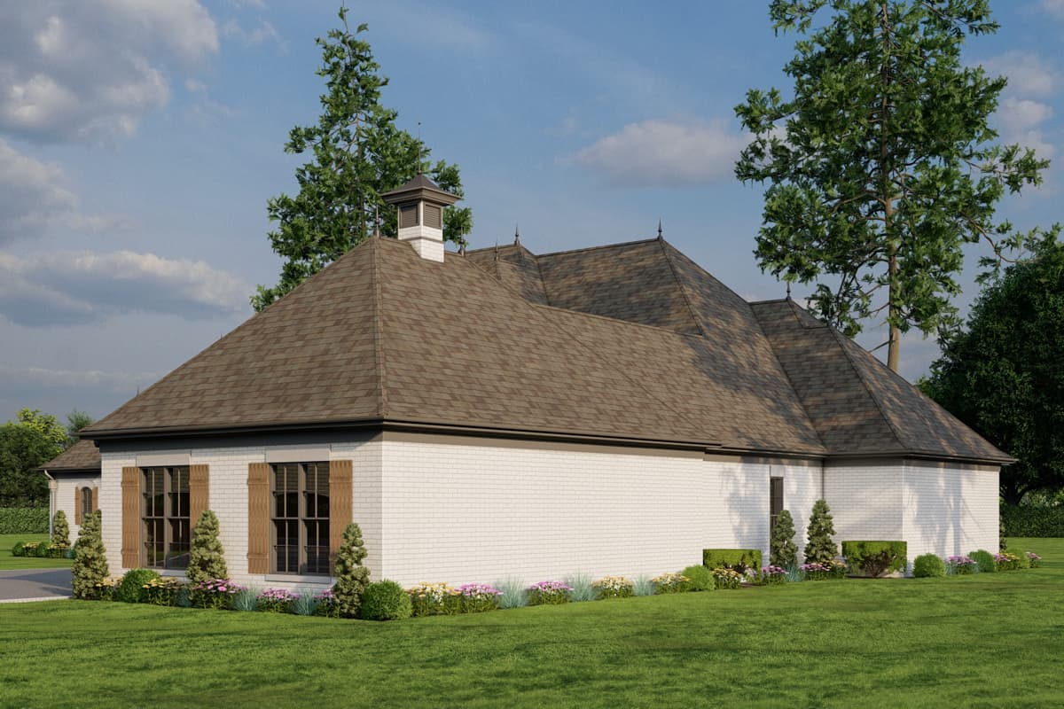 House plan exterior: Traditional style home with white brick, multi-level gabled roof, cupola, and decorative shutters on windows.