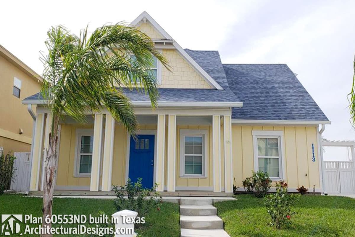 House plan exterior: Two-story home with a gabled front, shingled gable end, covered porch with square columns, and vertical siding.