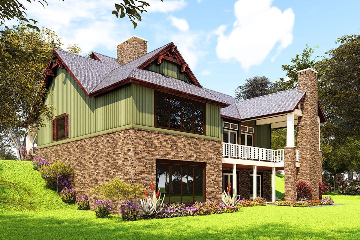House plan exterior with stone base, green siding, gable roof with decorative trim, and a covered balcony with white railing.
