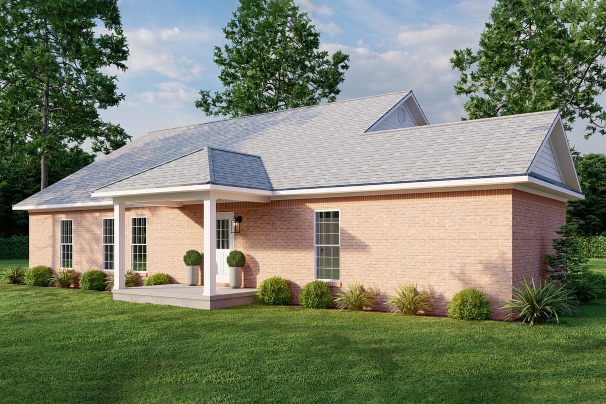 House plan exterior: single-story ranch with brick facade, covered front porch with columns, and varied rooflines.
