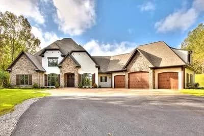 Euro-Style House Plan with Vaulted and Beamed Ceilings and Angled 3-Car Garage - 3752 Sq Ft