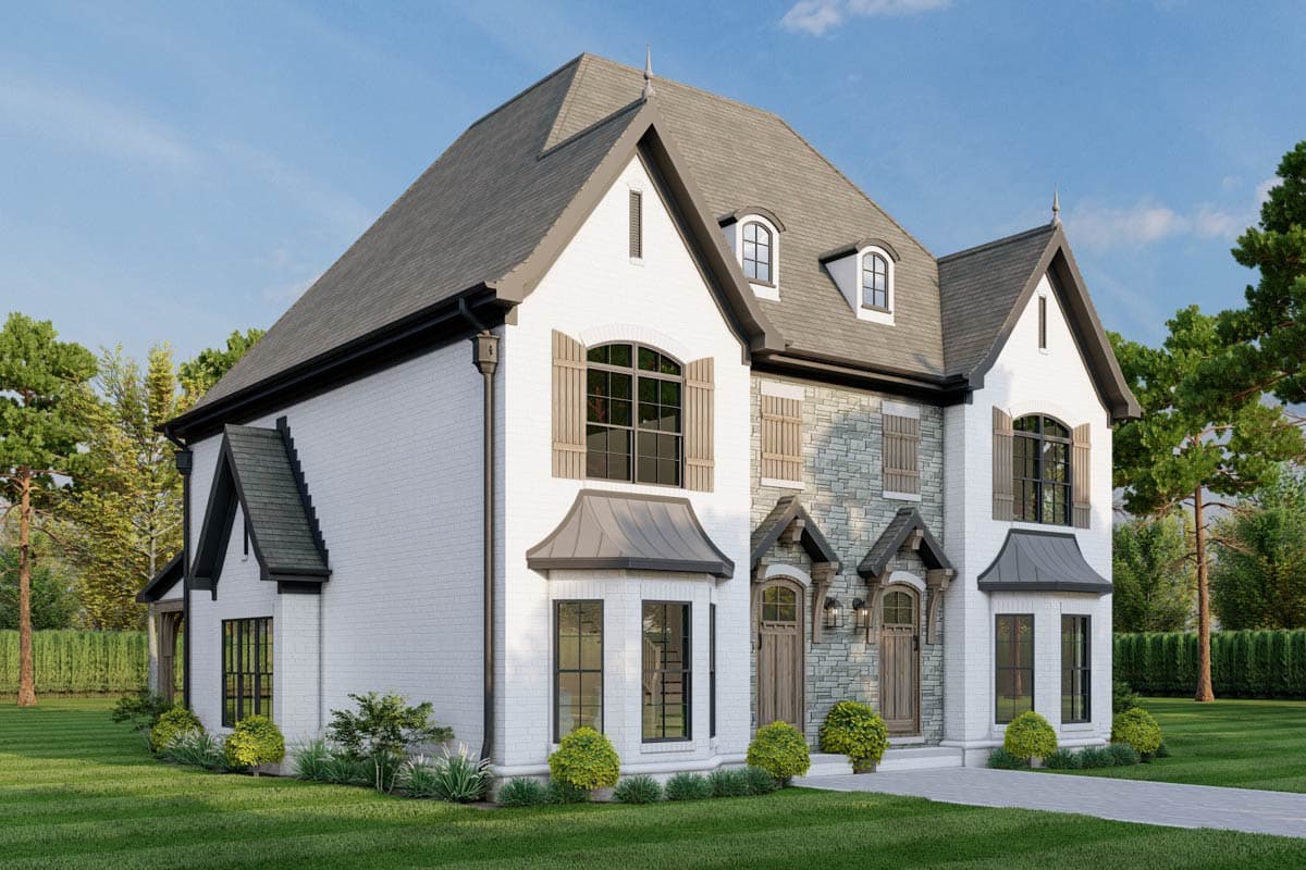 House plan exterior: two-story, white brick and stone facade, steep gables, dormer windows, bay windows, and arched entrances.