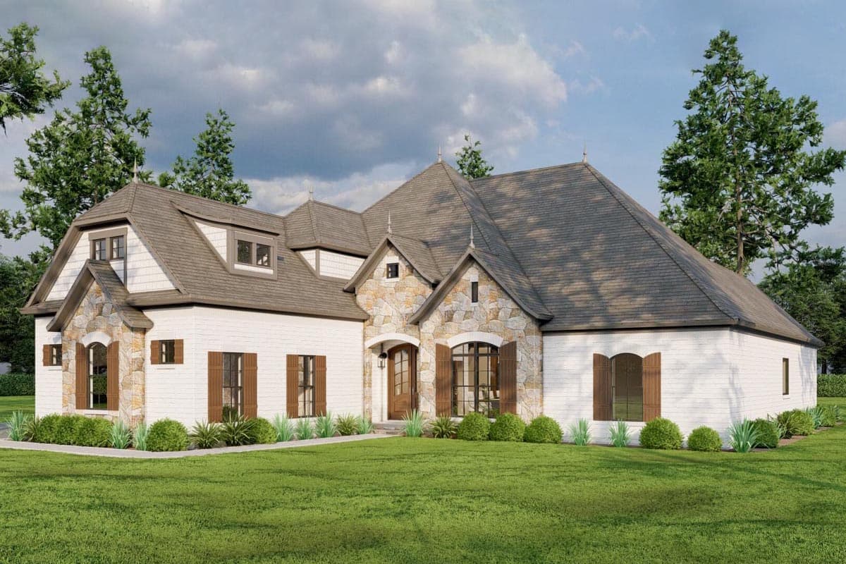 House plan exterior with stone accents, multiple gables, and dormers. Features include an arched entryway and decorative shutters.