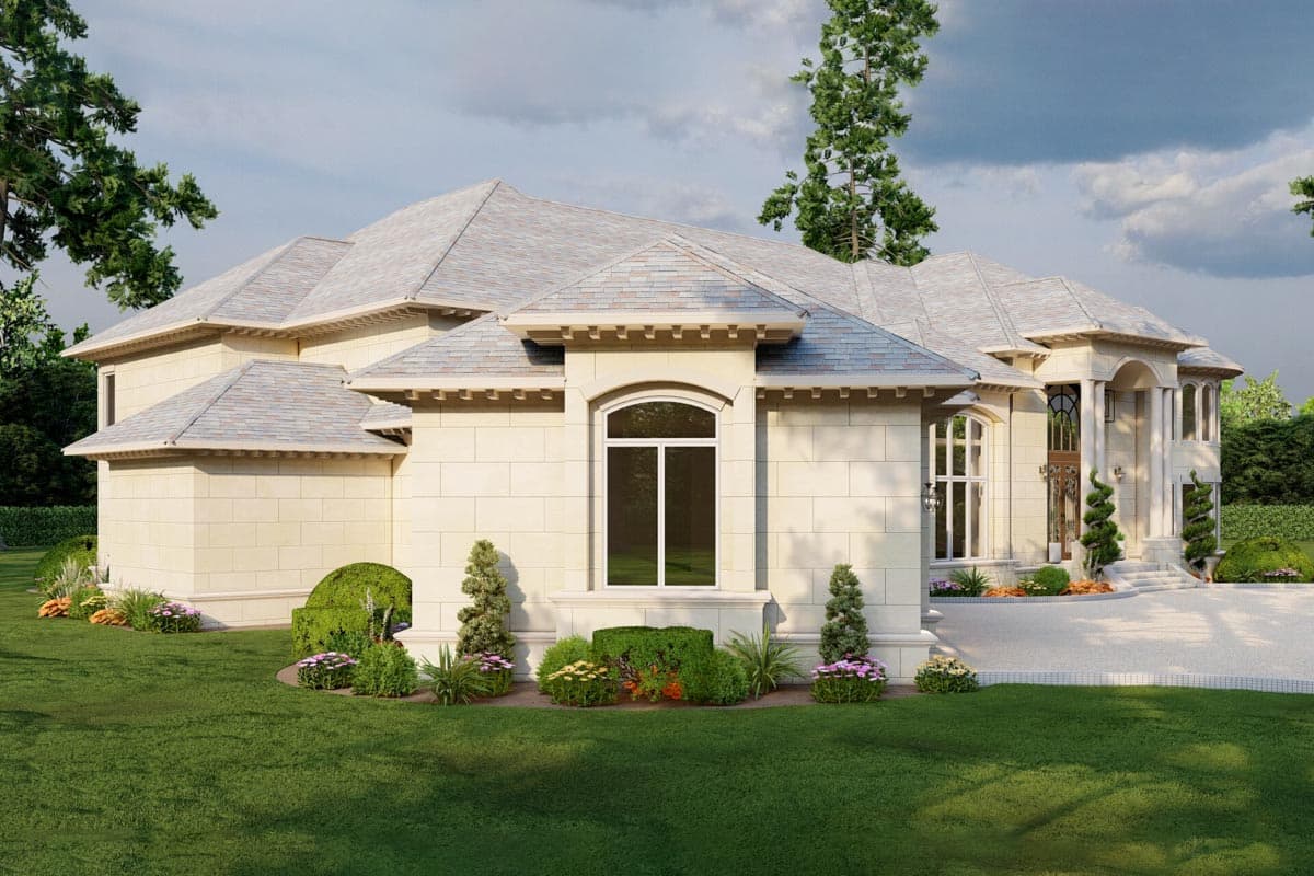 House plan exterior view showcasing a stone facade, multiple gables, arched window, and grand portico with columns.