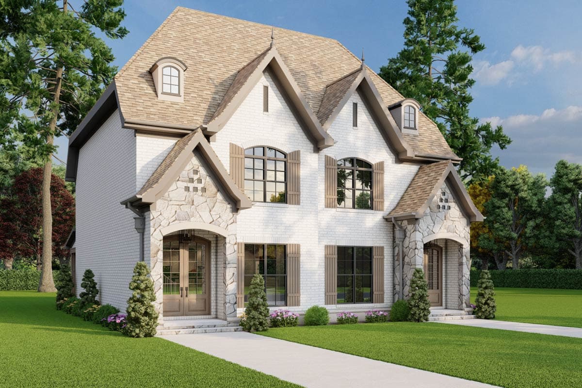 Two-story house plan exterior with white brick, stone accents, arched entryways, dormers, and multiple gables.