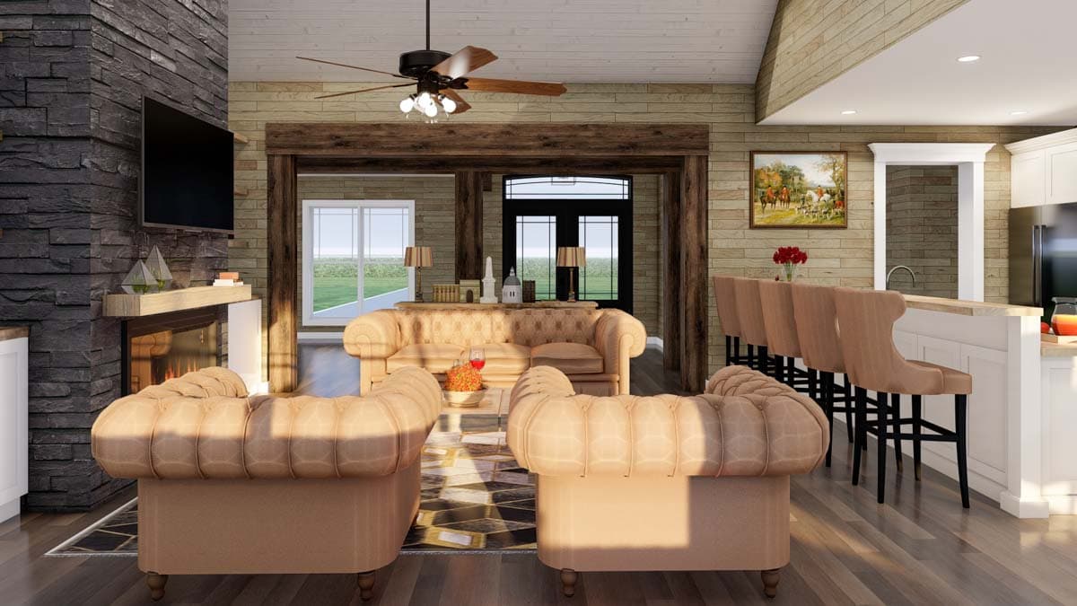Interior rendering of a great room with stone fireplace, open beams, seating area, and kitchen island with bar stools.