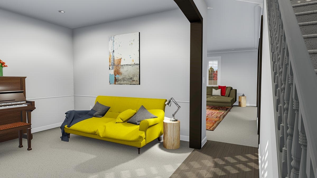 Interior view showing a living area with a piano, yellow sofa, and an open doorway to another room with a sofa and stairs.