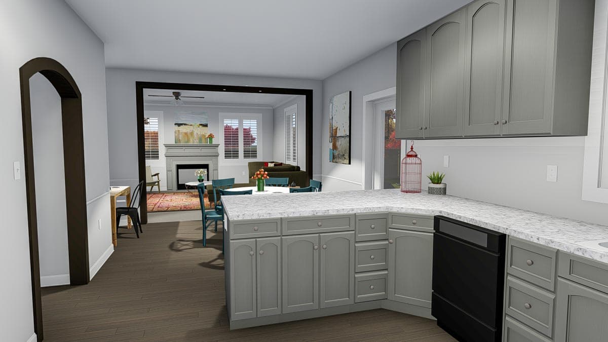 Interior view of a house plan showing an open kitchen with gray cabinets, white countertops, and an adjoining dining and living area with a fireplace.