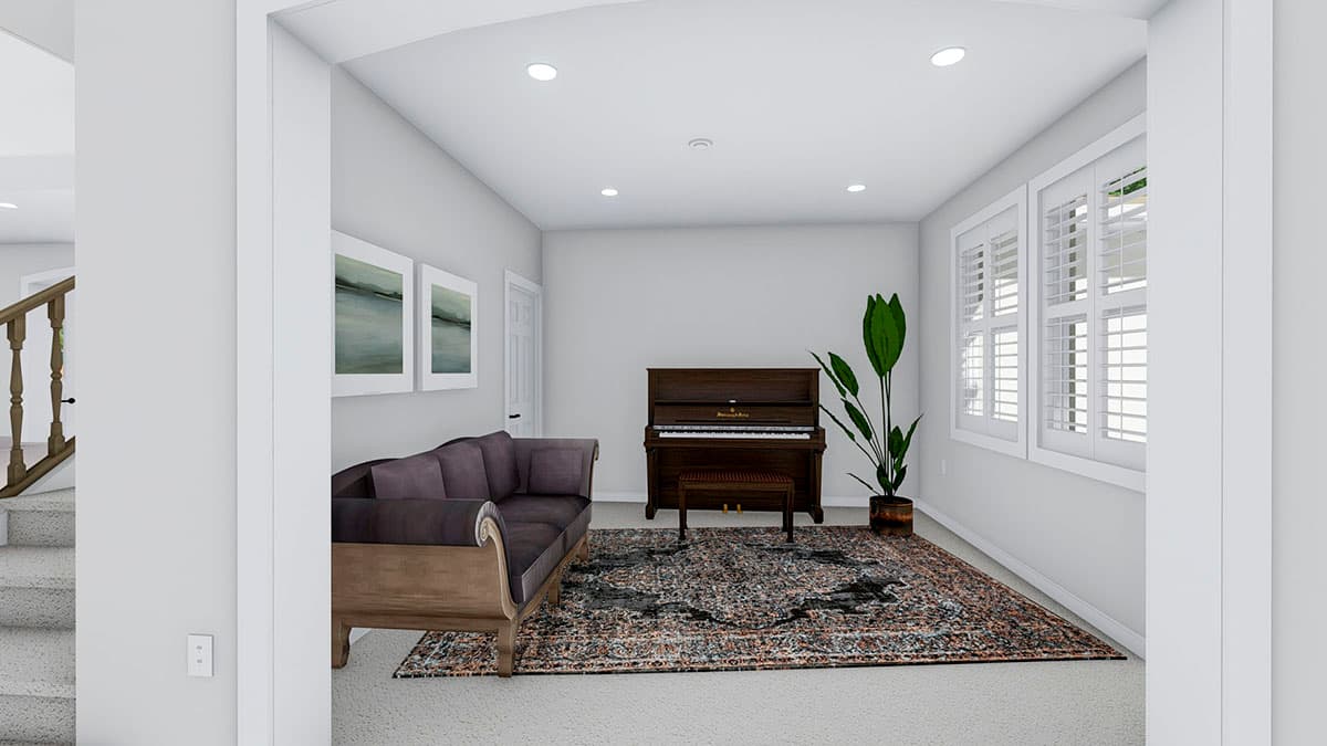 Living room with upright piano, sofa, oriental rug, two artworks, and shuttered windows. Staircase visible to the left.