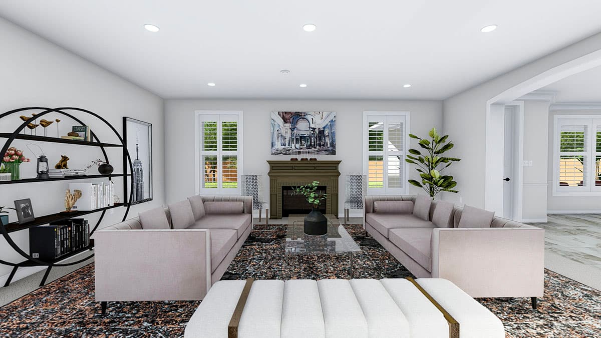 Living room with fireplace, two sectional sofas, and a large circular bookshelf with decor.