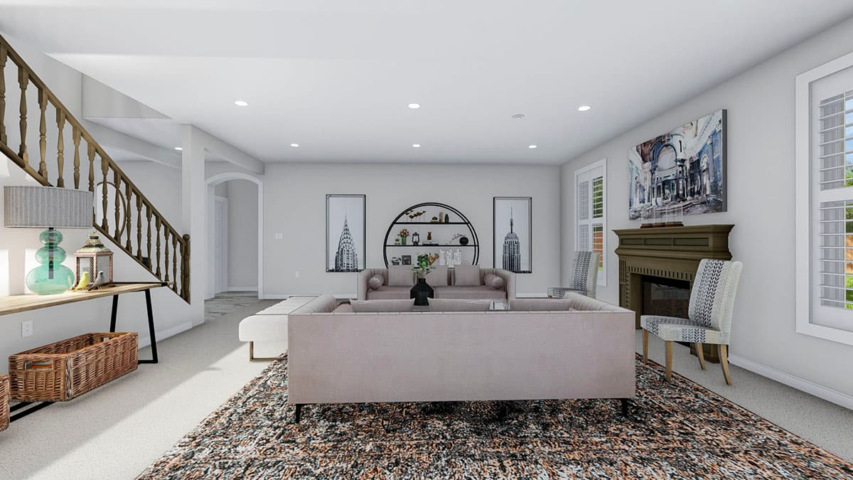 Interior rendering: Great room with fireplace, sectional sofa, wooden staircase, and Empire State Building artwork.