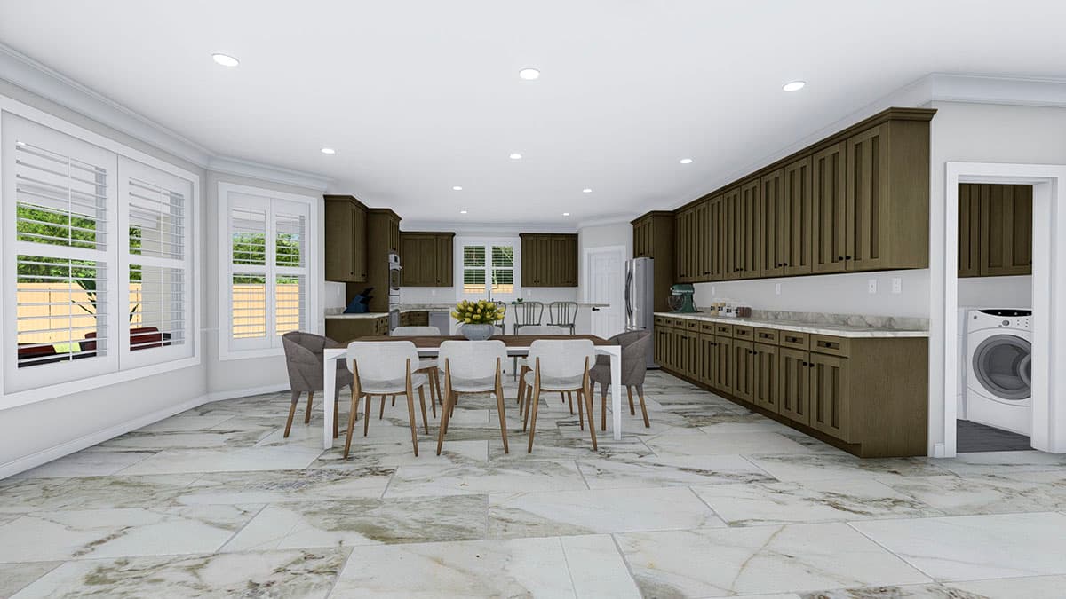 Open concept kitchen and dining area with dark wood cabinets, island, and large windows. Laundry area visible.