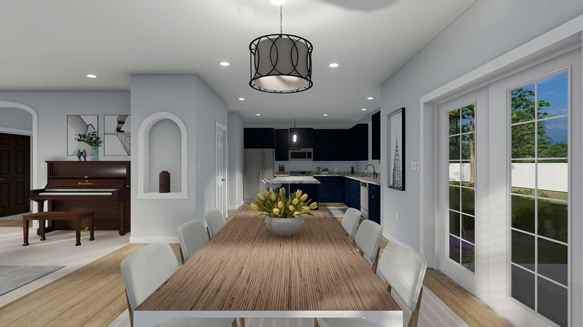 Dining area rendering showing a wooden table, chairs, and view into a kitchen with dark blue cabinets and a stainless steel refrigerator.