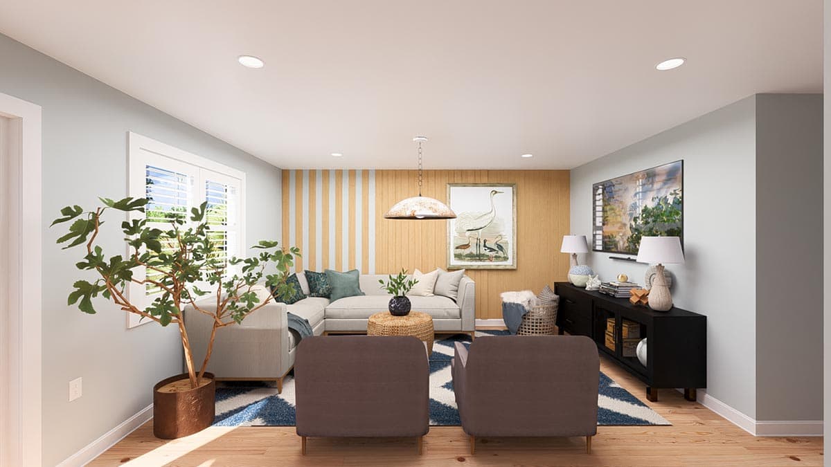 Living room with sectional sofa, two chairs, coffee table, media console, and wall art.