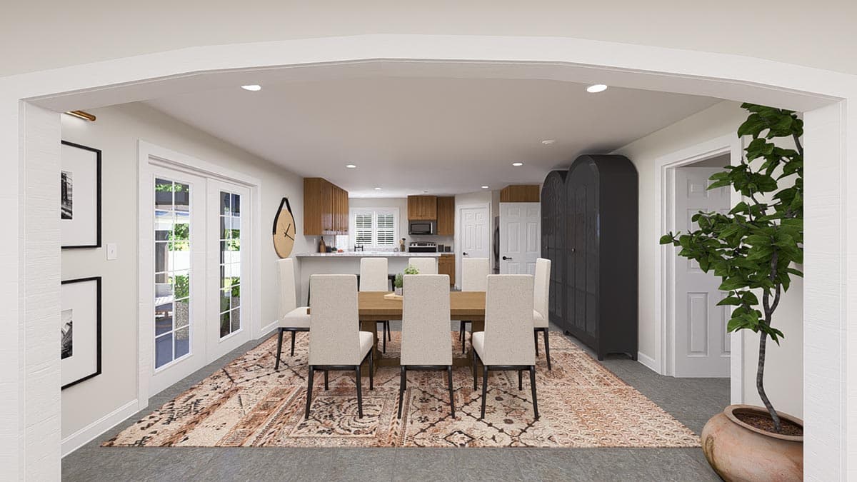 Dining area and kitchen with wood cabinets, island, and dining table with chairs.